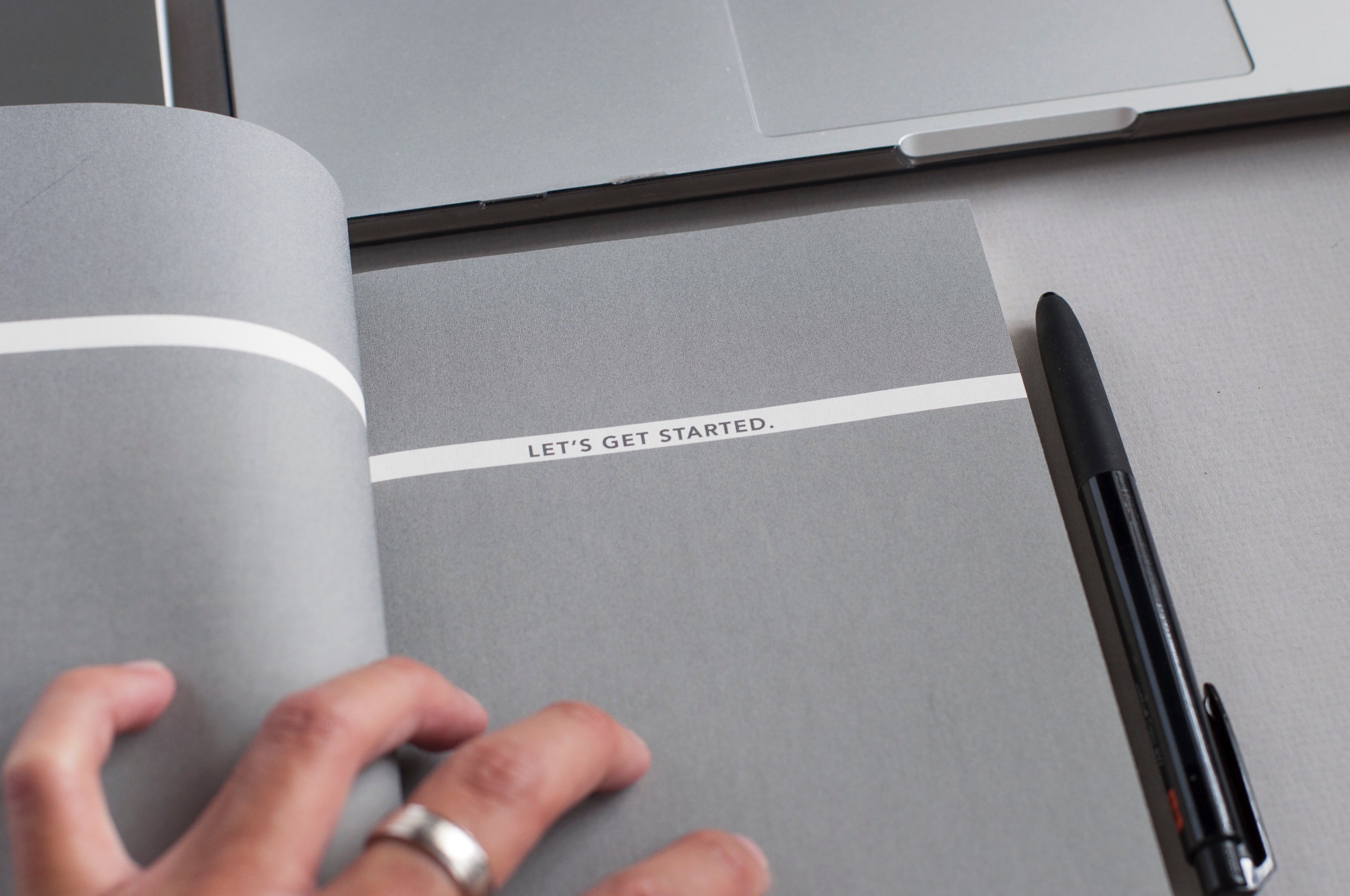 Text on Notepad: "Getting Started"