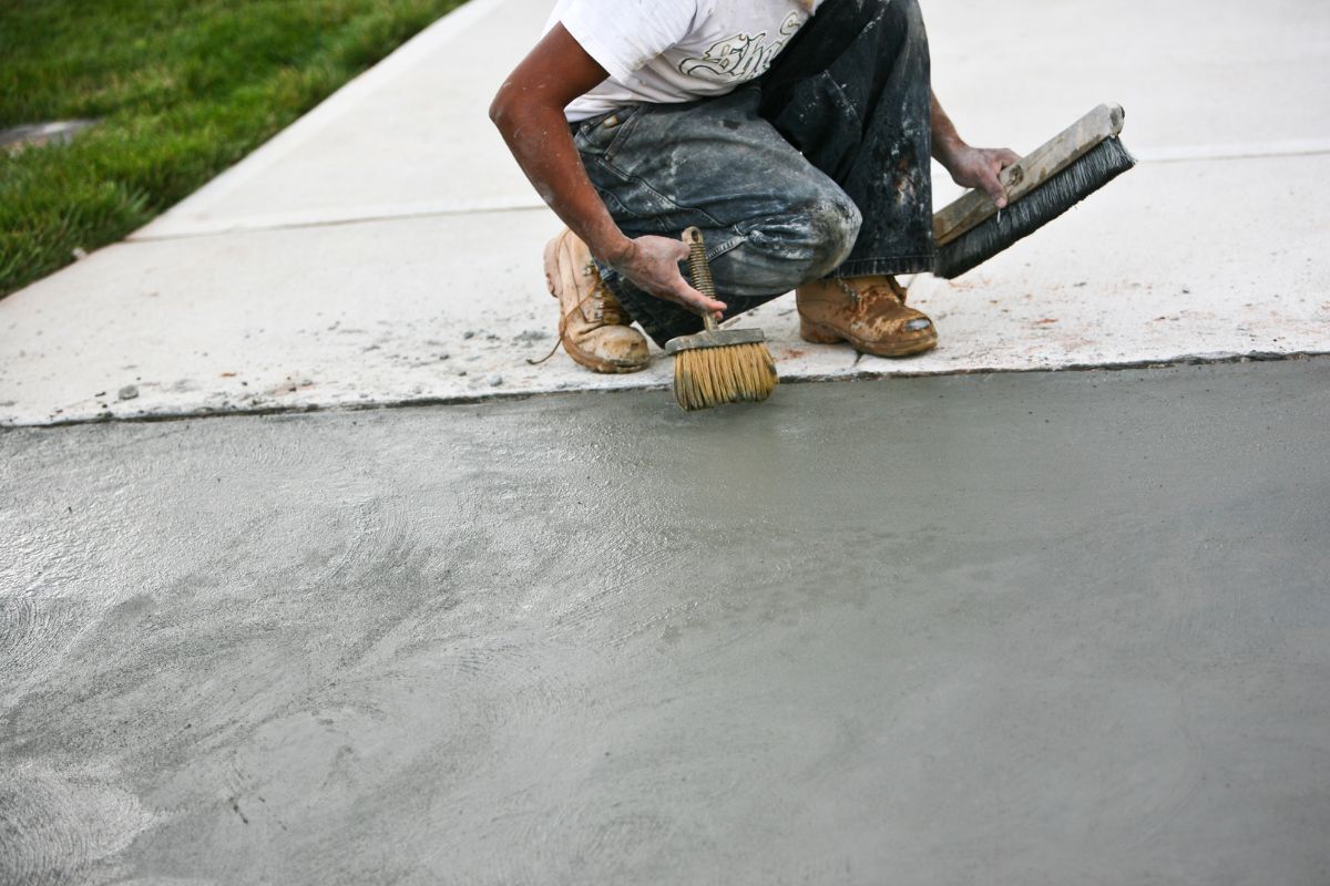 What is the recommended method to clean a resin driveway?
